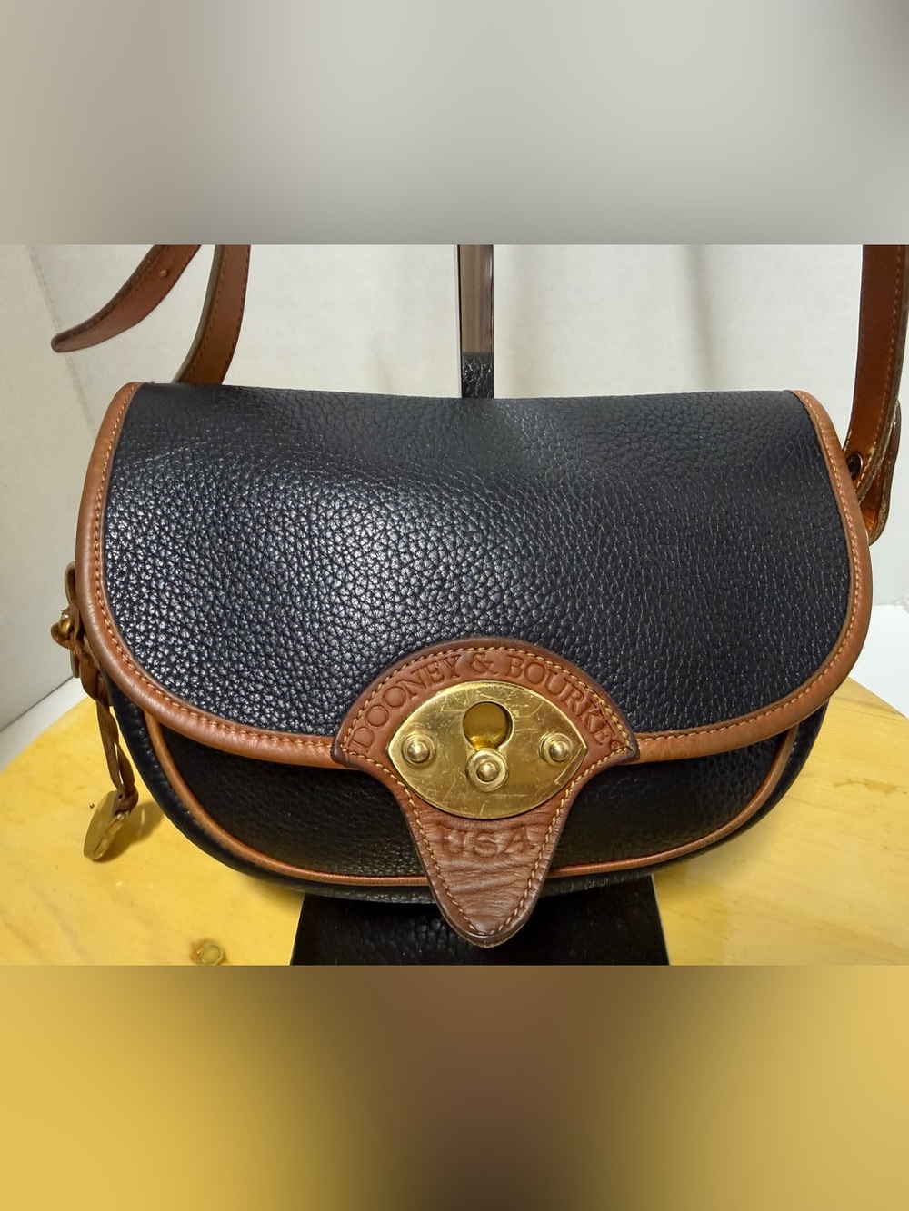 Dooney & Bourke Vtg Black Pebbled All Weather Leather Calvary Saddle Bag Brass
